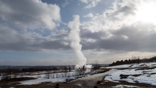 Strokkur's eruption leaves behind a plume of white steam